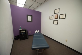 chiropractic room with electric muscle stimulation machine